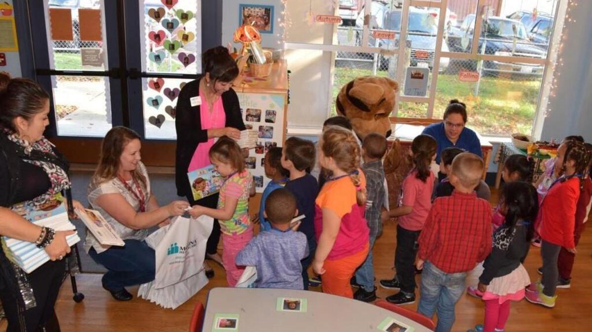 Tillicum Head Start students receive books Oct. 22, thanks to a grant from the Molina Foundation