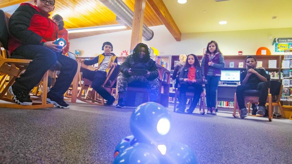 Students learn to program a robot named “Dash” at a session of Coding Club at Mann Elementary School in Tacoma, February 1, 2018. Tacoma schools stand to get less of a boost from a new funding plan than some richer districts.