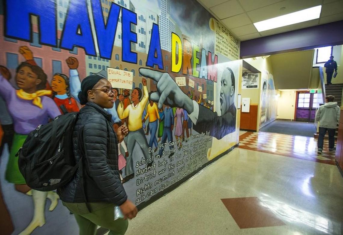 Nia Hall heads down a hallway at Garfield High School to attend her calculus class. The Garfield High student’s family recently moved to Shoreline, which has lengthened her commute.