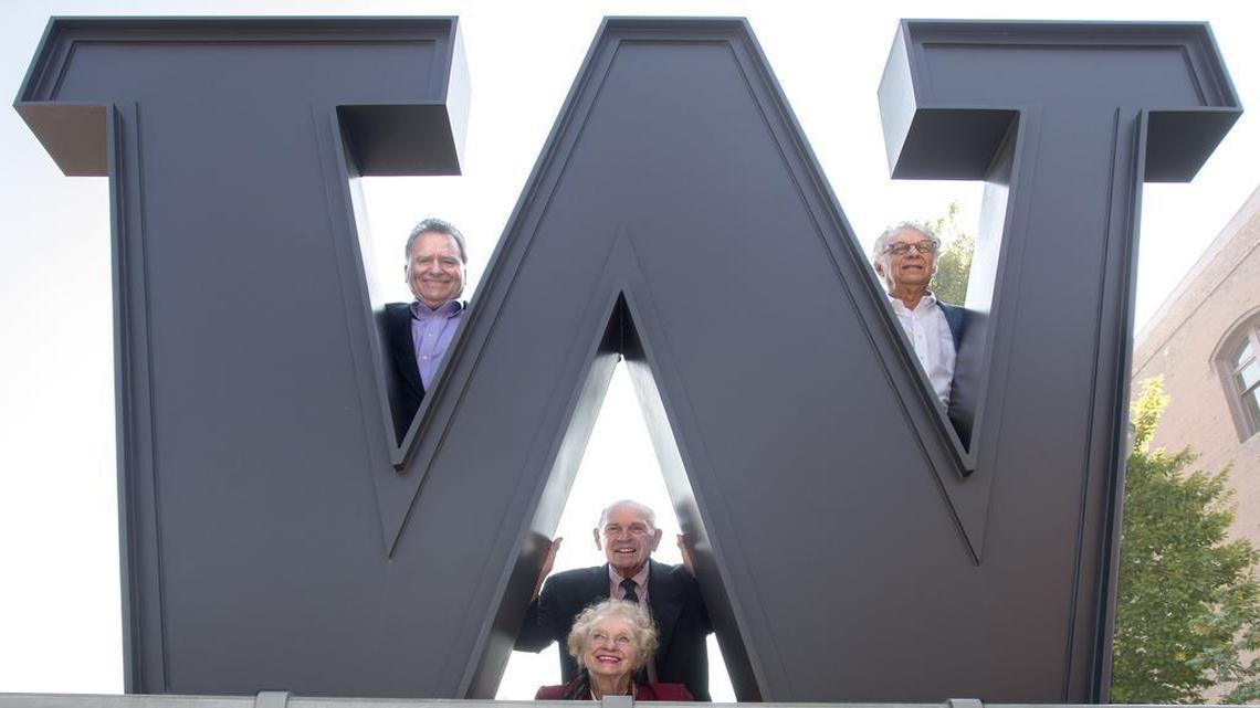Former state House Speaker and Tacoma Mayor Brian Ebersole, top left, businessman and UW Regent Herb Simon, top right, Columbia Bank founder and CEO William W. Philip, center, and former City Councilwoman Dawn Lucien celebrate UWTacoma on Tuesday.