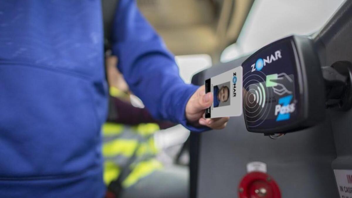 A student uses a Zpass when boarding or exiting the school bus.