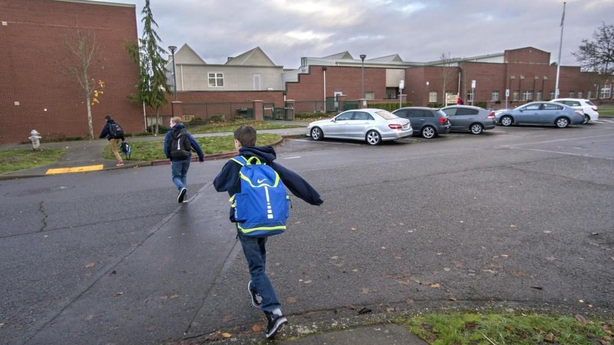 Students head to Mason Middle School in Tacoma's Proctor District on Monday, Nov. 28, 2016.
