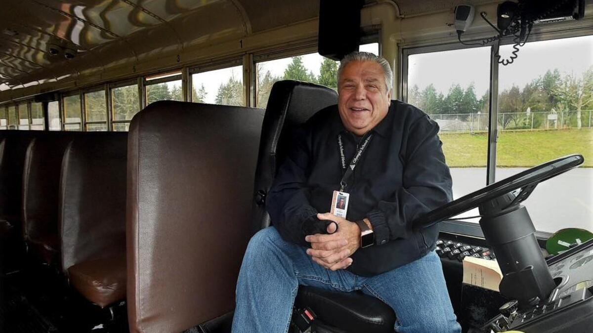 Olympia School District bus driver James Bratager picks-up Marshall Middle School students Feb 3rd as he’ll be honored during a school assembly Friday for his quick-thinking actions behind the wheel while avoiding a head-on collision last month.