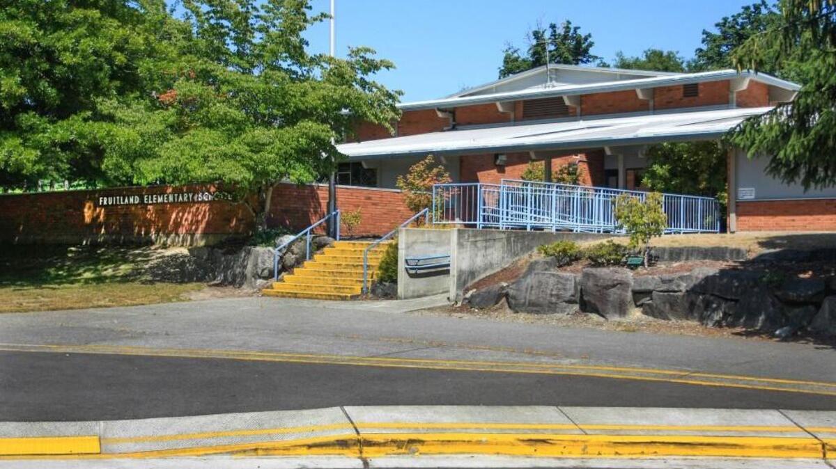 Fruitland Elementary School was locked down for more than an hour Thursday afternoon after students reported seeing a man with a gun in the woods nearby, according to Puyallup police.