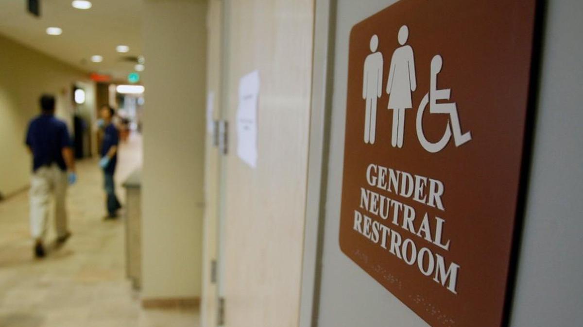 A sign marks the entrance to a gender-neutral restroom at the University of Vermont in Burlington, Vt. Students at Vashon Island High School asked the school board to undergo a $25,000 project to convert two gendered bathrooms to gender-neutral. The new bathrooms open Jan. 2.