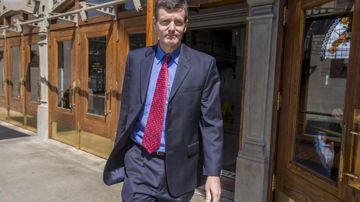 A grim-faced Troy Kelley walks out of the U.S. District Courthouse in downtown Tacoma, April 25, 2016, during a break in his criminal trial.