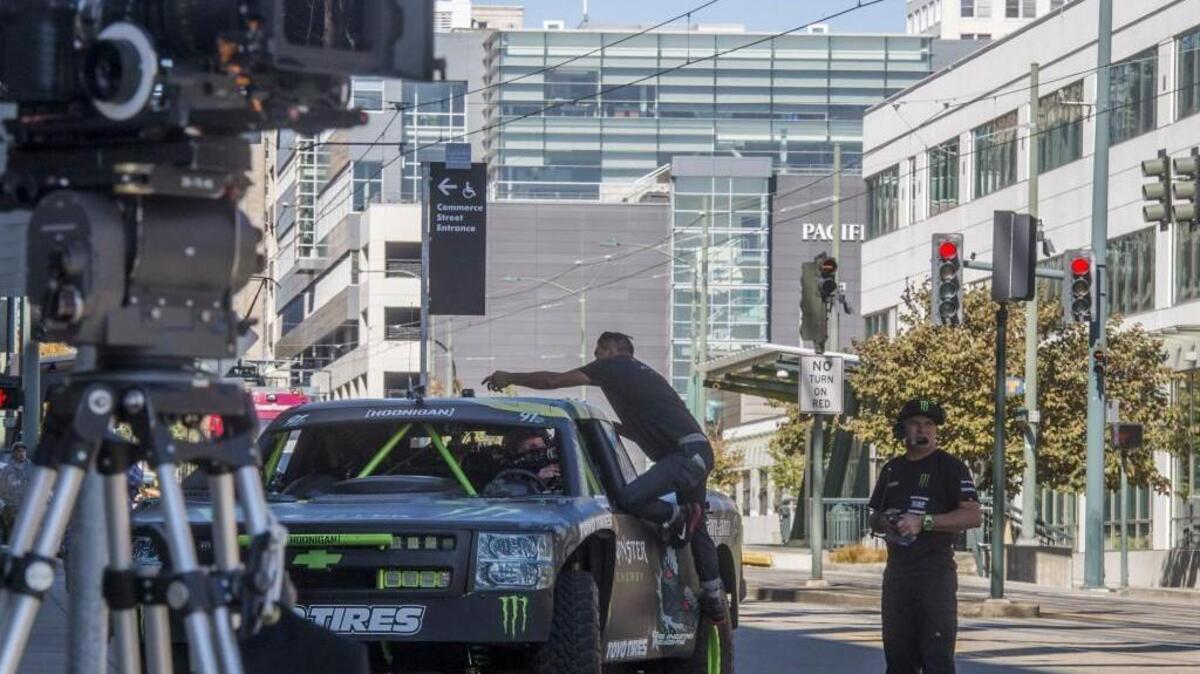 
A member of the filming crew starts a GoPro on the top of tricked-out truck before the crew shoots a scene Sunday between the Convention Center the Tacoma Art Museum.
