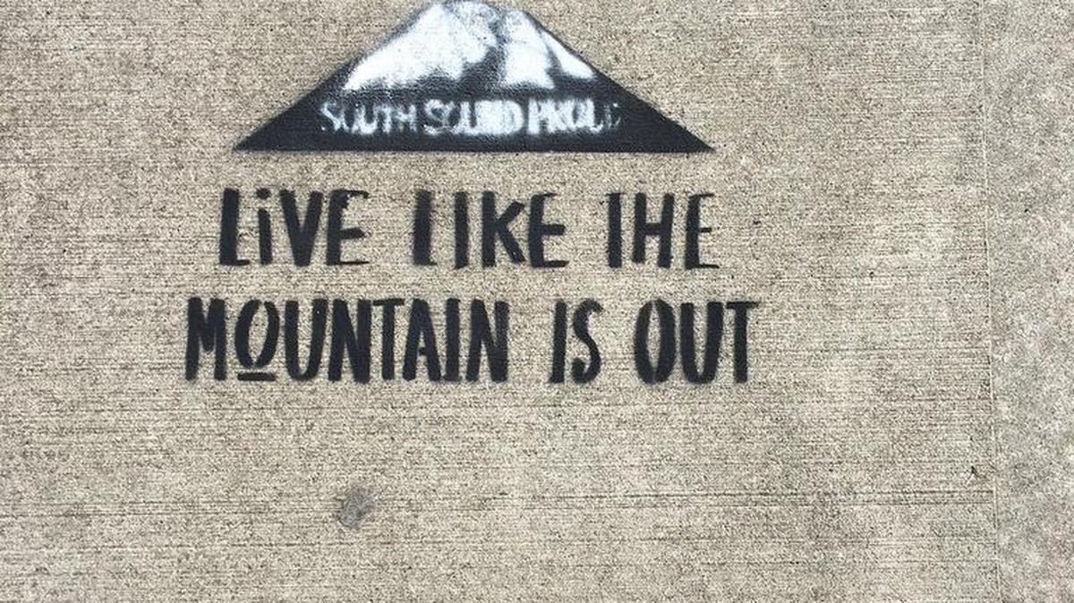 A South Sound Proud logo spray-chalked on a sidewalk in downtown Tacoma last week.