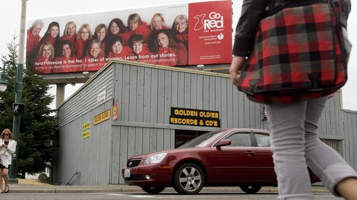 A large billboard hovers over the northeast corner of Sixth Avenue and Union Street in August 2011. The City of Tacoma and billboard company Lamar are negotiating a compromise over what to do with the company’s nearly 300 billboards in the city limits.