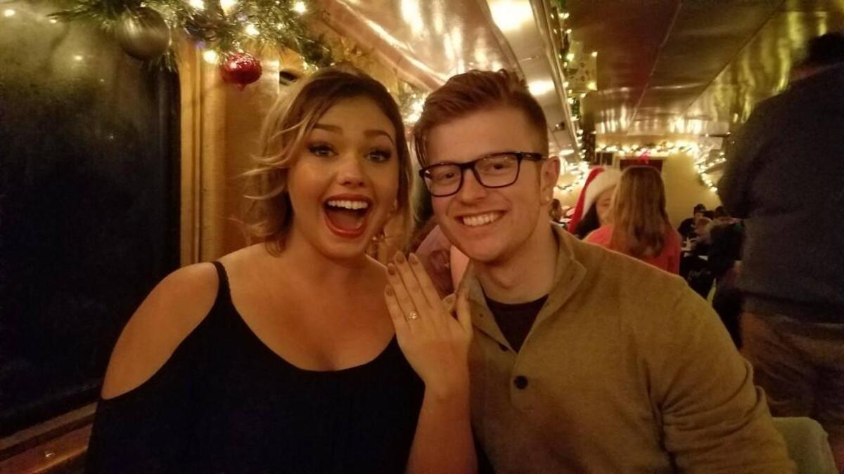 Summer Holst shows off her ring moments after her engagement to Pierce County firefighter Lucas Mayne onboard the Polar Express on Dec. 3, 2017.