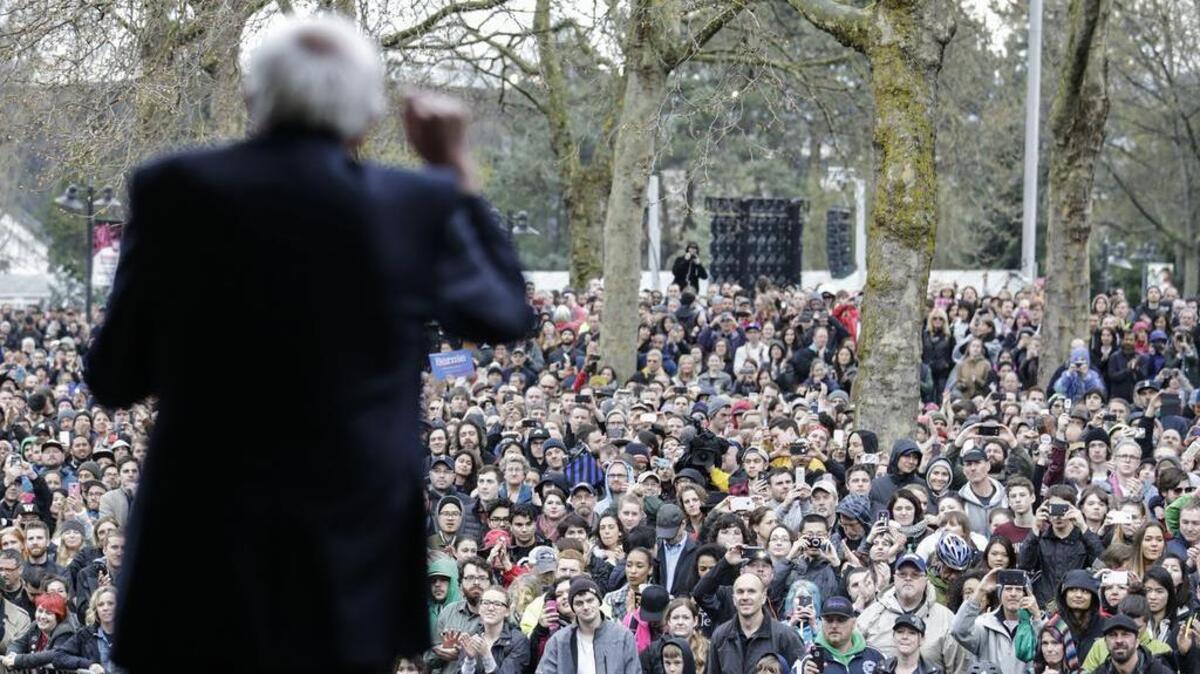 Democratic presidential candidate Sen. Bernie Sanders, I-Vt. speaks to an overflow crowd on Sunday before a campaign rally in Seattle.