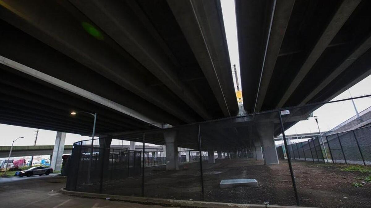Fencing has been installed under the Spokane Street Viaduct to keep the homeless out.