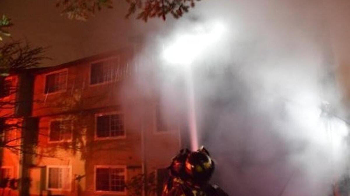 Firefighters battle a two-alarm apartment fire Sunday in the 23200 block of 88th Avenue South in Kent.