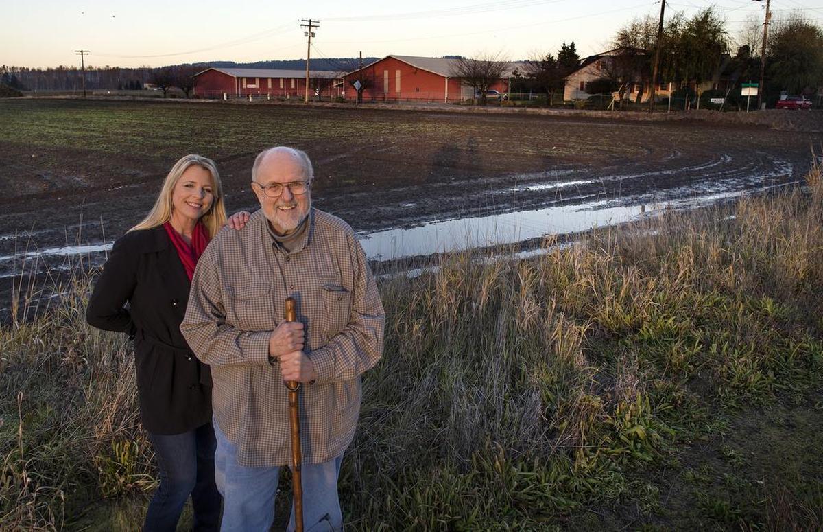 Retired daffodil farmer Neil Van Lierop is pleased that the sale of his family’s property has reached a harmonious resolution. Six of the 24 acres will be purchased by Step By Step, a nonprofit that helps at-risk mothers support healthy babies. It was founded by Krista Linden, left.