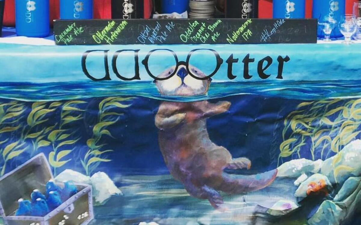 This one-of-a-kind banner was stolen from the Odd Otter Brewing Co. booth at Taste of Tacoma over the weekend, founder John Hotchkiss says. The brewery is offering a no-questions-asked reward for its return.