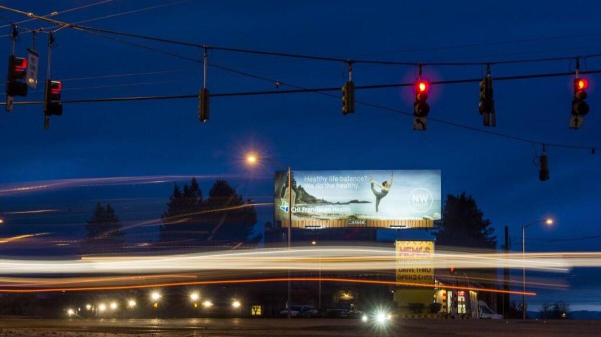 The 46-foot-tall billboard near South Sprague and Division avenues in Tacoma, pictured here on Friday, Jan. 19, won’t be going anywhere, despite a revamped sign code and agreement with advertising giant Lamar.