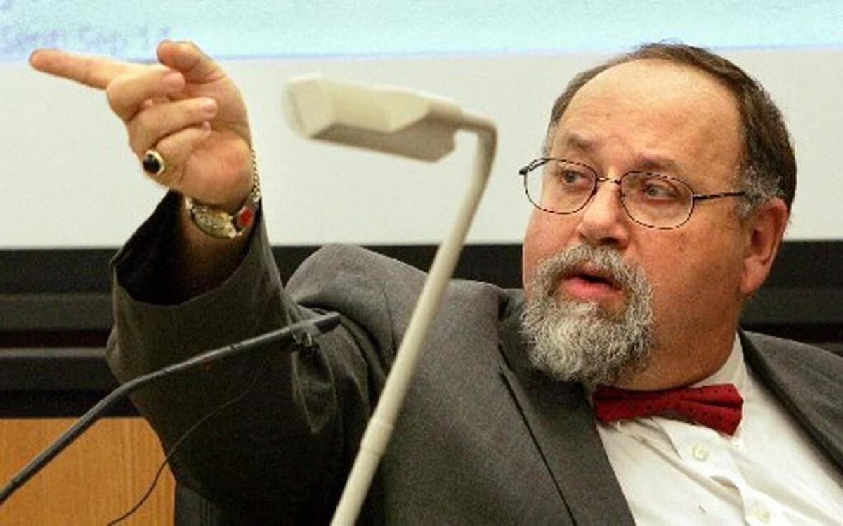 Michael Hecht testifies during his trial on charges of patronizing a prostitute and felony harassment.