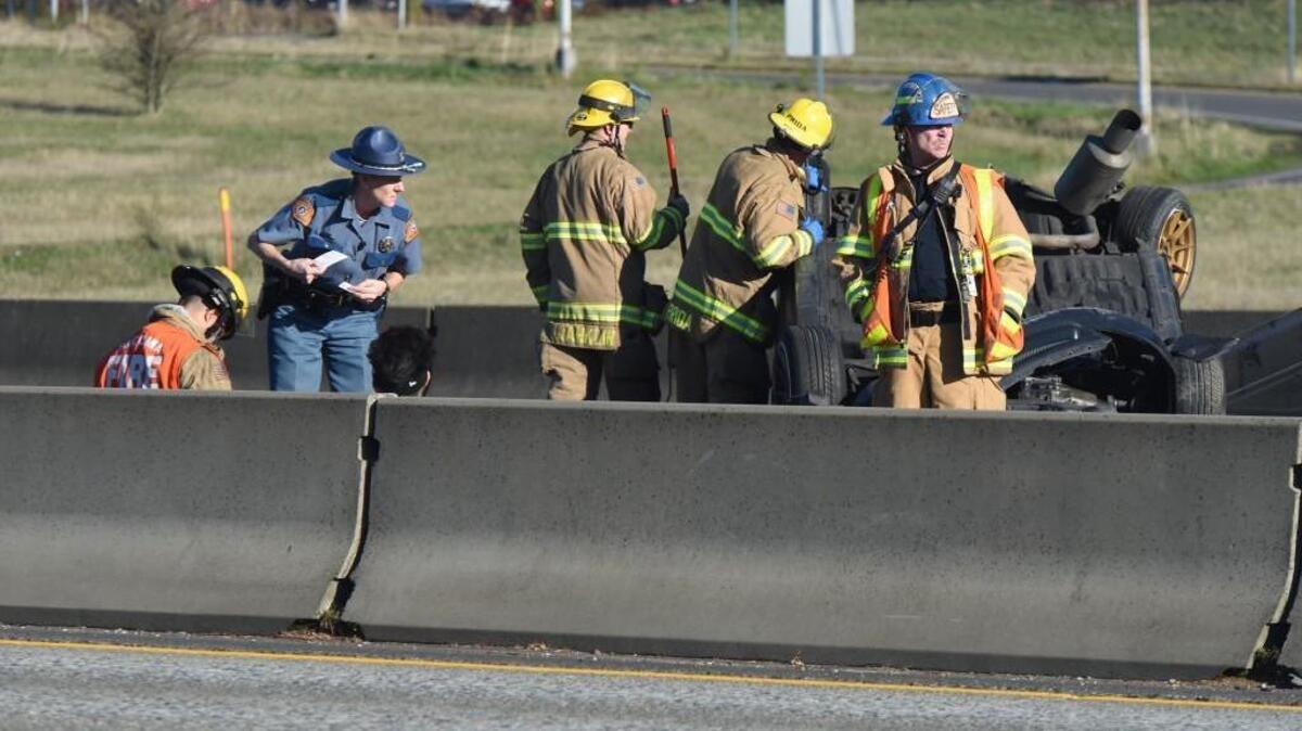 A Washington State Patrol trooper talks with the driver involved in a wreck on northbound I-5 near the Tacoma Mall on Tuesday.