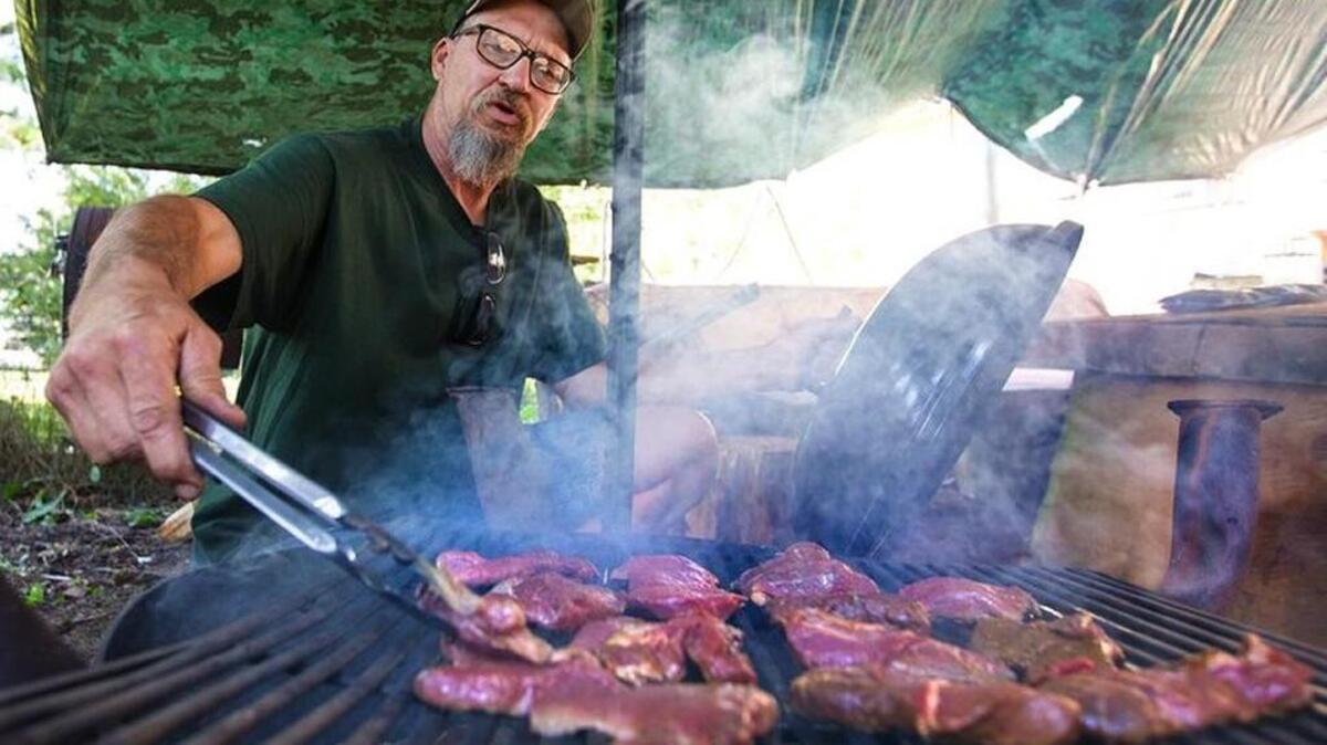At his Lynden home, Tim Bento grills deer meat he obtained as roadkill along a highway. Bento has collected four deer killed on the road this year. The Washington Fish and Wildlife Commission changed state code to allow the salvage of elk and deer accidentally killed by vehicles.