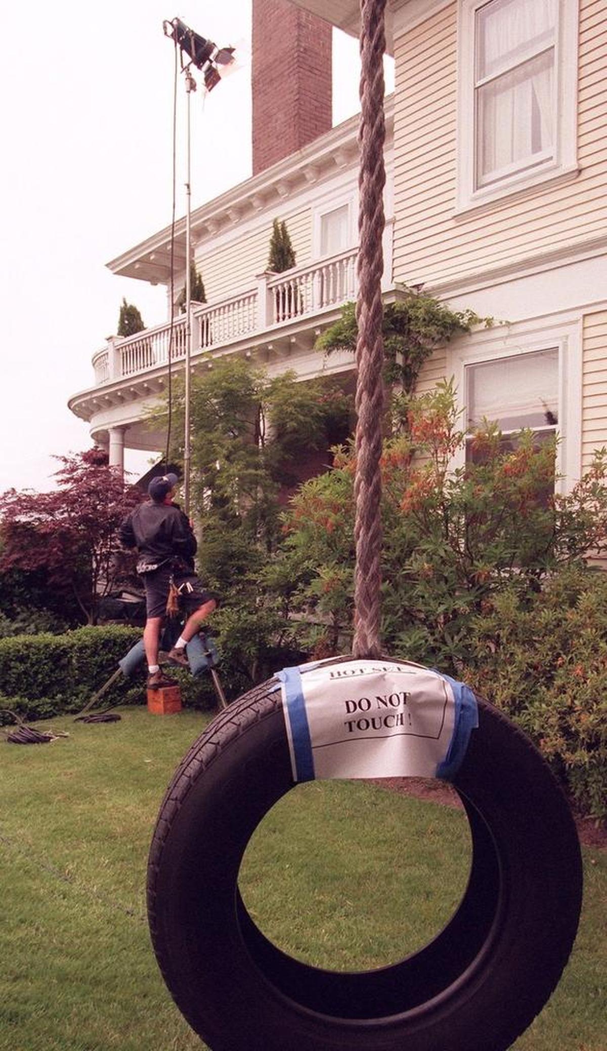 Ian Jennings, a freelance crew member, adjusts a lamp for the set of “10 Things I Hate About You.”