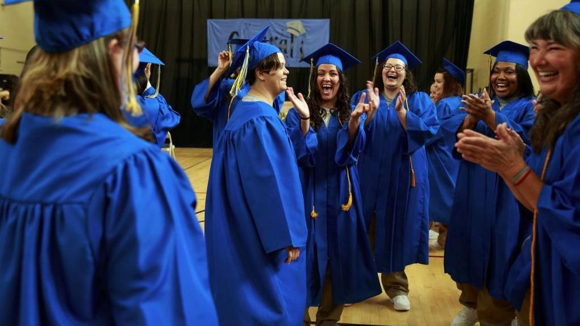 Graduates laugh before the Freedom Education Project Puget Sound graduation ceremony at the Washington Corrections Center for Women. This year’s class is nearly five times bigger than last year’s graduating class of four.