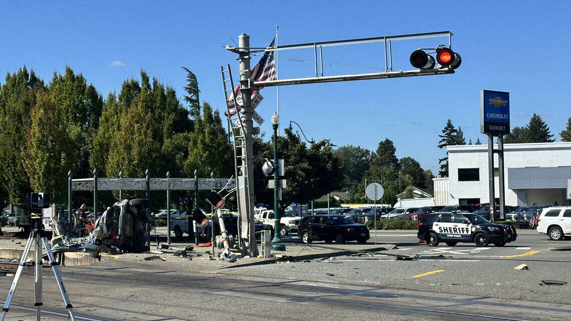 Train splits vehicle in two, seriously injuring driver in Pierce County wreck