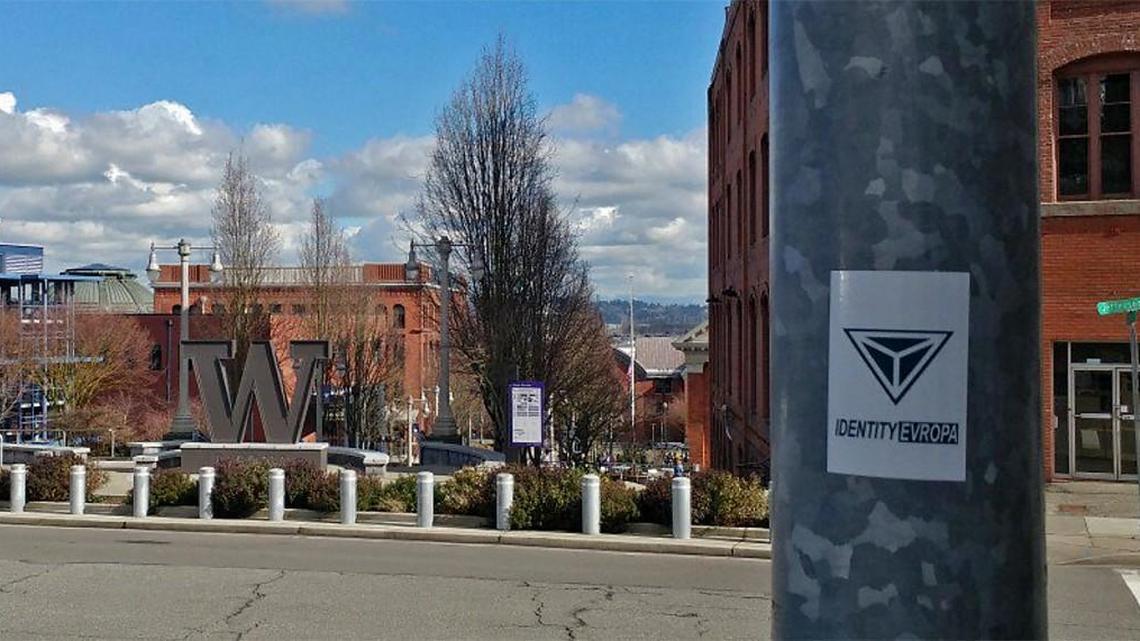 A photo from the Twitter account of Identity Europa shows a sticker for the group on a pole outside The Swiss, across from the University of Washington Tacoma. The photo was tweeted March 2, 2018.