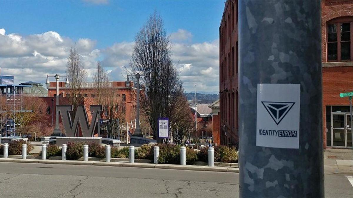 A photo from the Twitter account of Identity Europa shows a sticker for the group on a pole outside The Swiss, across from the University of Washington Tacoma. The photo was tweeted March 2, 2018.