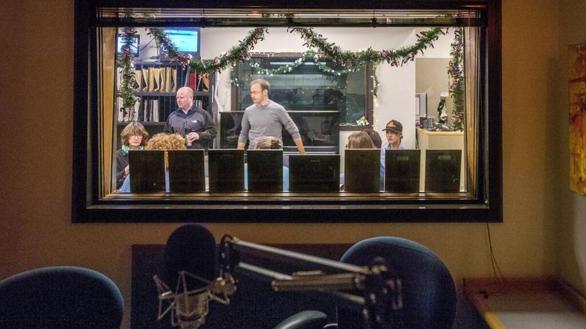 The news staff’s morning meeting as seen from a broadcast studio in the Seattle offices of KPLU. As of Wednesday afternoon Friends of 88.5 FM had raised $6,430,000, given by 17,000 individuals and businesses. When it reaches $6.5 million a matching $500,000 pledge will kick in.