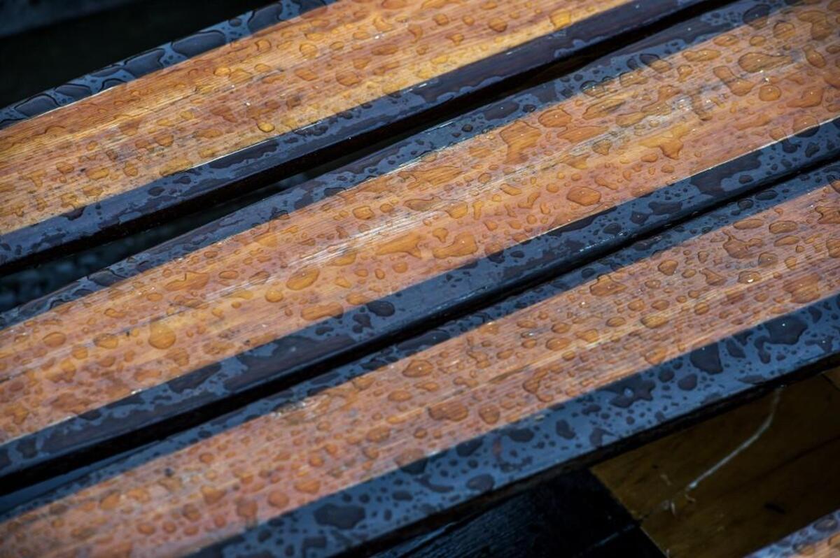 Raindrops bead up on the heavy cedar oars of The Porpoise, a replica survey gig longboat, similar to the one the Wilkes Expedition rowed into Gig Harbor in 1841. Reenactors rowed the Porpoise into the harbor in vintage naval uniforms to celebrate the 175th anniversary in 2016.