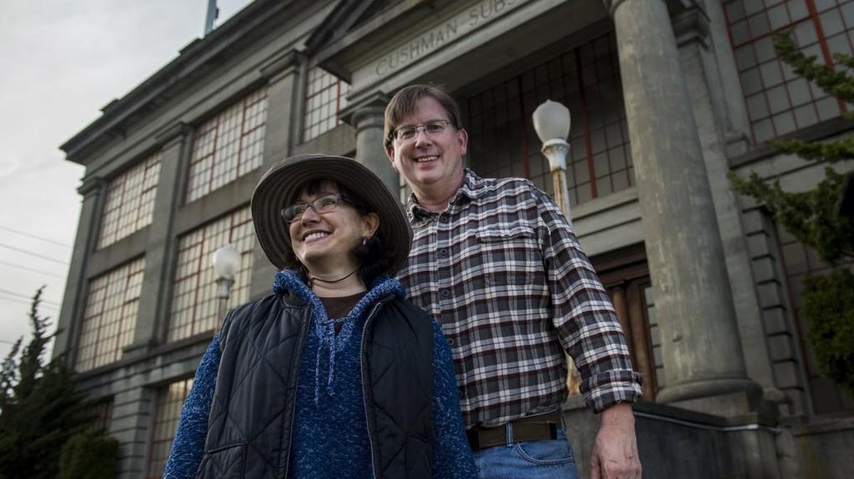 Local architect Jeffrey Ryan and wife Susan stand outside the Cushman Substation in Tacoma on Friday. Ryan submitted the nomination to have the Cushman and Adams substations, the switchyards and one lattice tower added to the city’s historic register.
