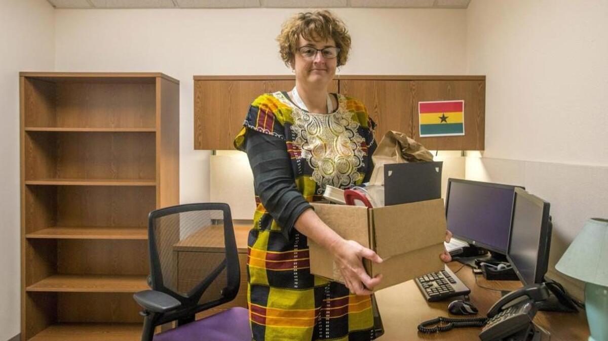 
Sheri Badger is packed up Sept. 10 and ready to leave her job with Pierce County Emerency Management for a posting in Ghana with the Peace Corps2015. In preparation for her going-away party, she has a Ghanaian dress and flag.
