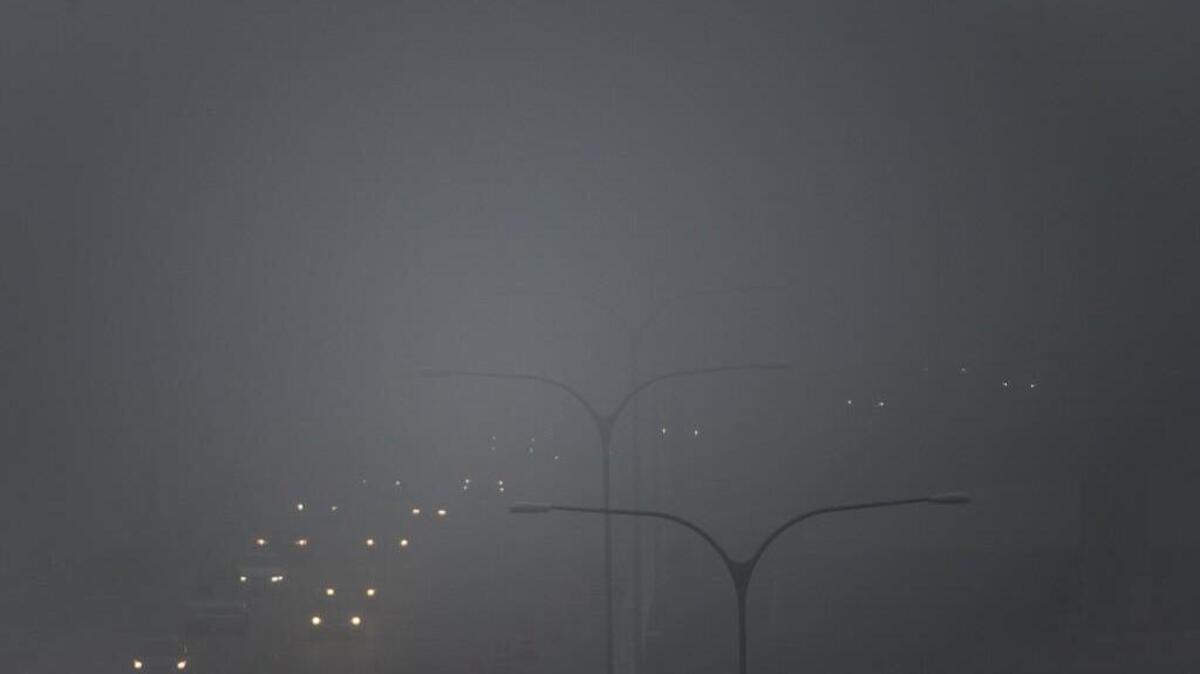 Drivers commute through fog as they make their way over the Nalley Valley overpasses in Tacoma on Dec. 4, 2017.