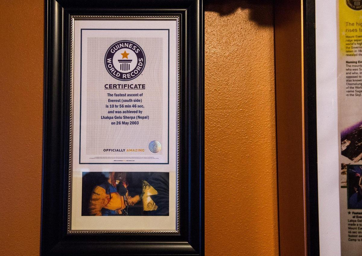 Lhakpa Gelu Sherpa’s world record certificate for the fastest ascent of Everest hangs at his restaurant, Wildberry Restaurant, in Ashford, Wash., on Thursday, June 20, 2019.