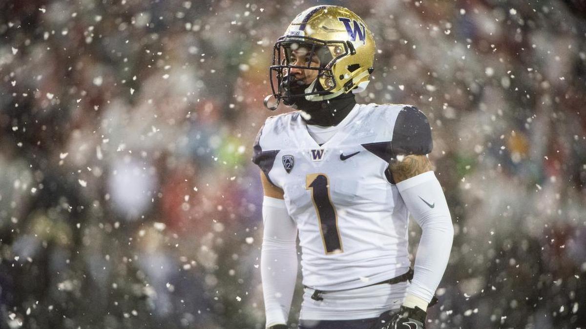 Washington’s Byron Murphy Jr. takes a moment in the snow between action. The Washington Huskies played the Washington State Cougars in the Apple Cup at Martin Stadium in Pullman, Wash., on Friday, Nov. 23, 2018.