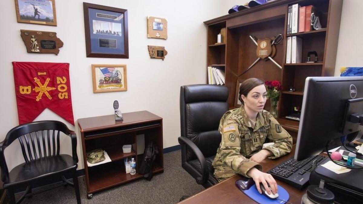 Capt. Kerri Turner, a regimental operations officer, in her Camp Murray office on Wednesday, Feb. 24, planning a culminating event for candidates in officer training.