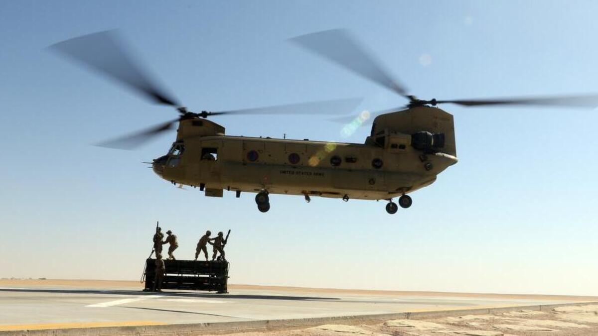 
A Washington National Guard battalion is in its final preparations for a deployment that will take it to Kuwait for much of 2016. Here, a CH-47 Chinook from the Colorado National Guard practices a cargo-lifting technique in Kuwait on Sept. 24.
