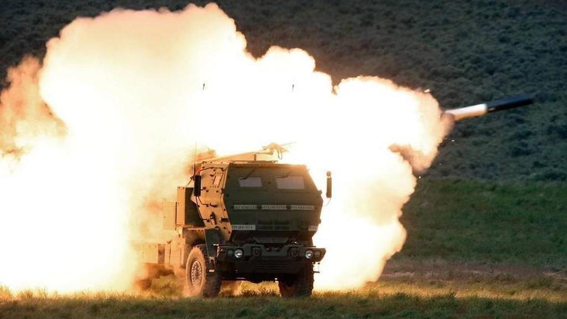 Flames engulf the launch truck as soldiers fire the High Mobility Artillery Rocket System (HiMARS) during combat training in the high desert of the Yakima Training Center.