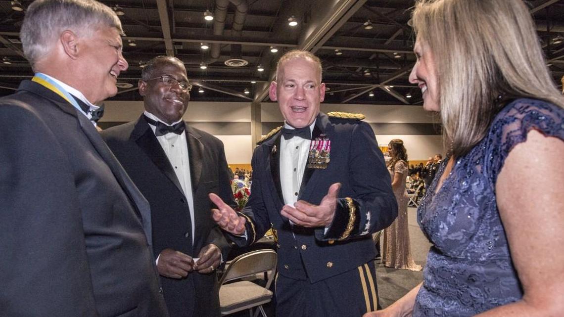 I Corps Commander Lt. Gen Stephen Lanza, center, hobnobs with local officials at the annual Army birthday celebration. Lanza, a former public affairs officer, has worked to deepen JBLM's civilian outreach. From left: Lakewood mayor Don Anderson and University Place city council members Kent Keel and Denise McCluskey. Photo taken at the Greater Tacoma Convention & Trade Center on Thursday, June 9, 2016.
