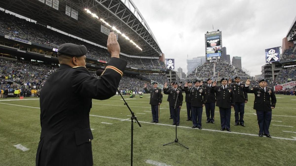 Washington National Guardsman are sworn-in during a re-enlistment ceremony on the field as part of the NFL’s Salute to Service tribute to the military before last November’s game between the Seahawks and the New York Giants in Seattle.