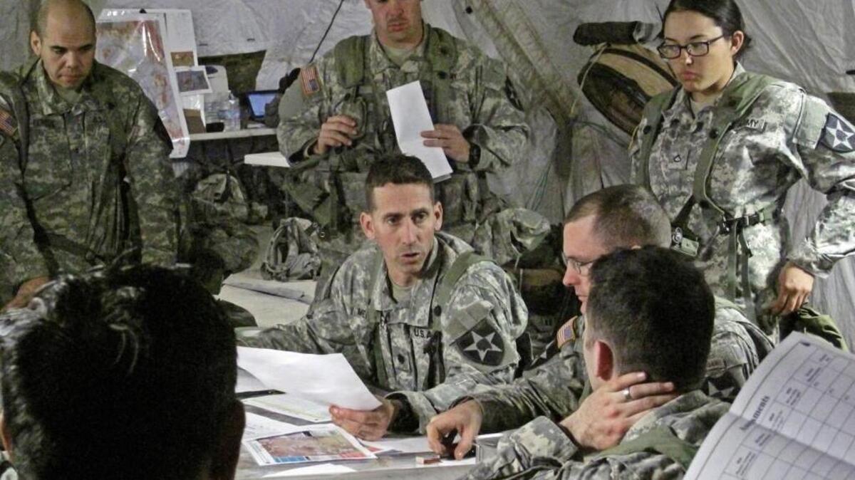 Army mobile headquarters often are a mix of high-tech computing and old-fashioned work with maps. In 2016, the Pentagon wants the Army to install Windows 10 on all of its tech hardware.
