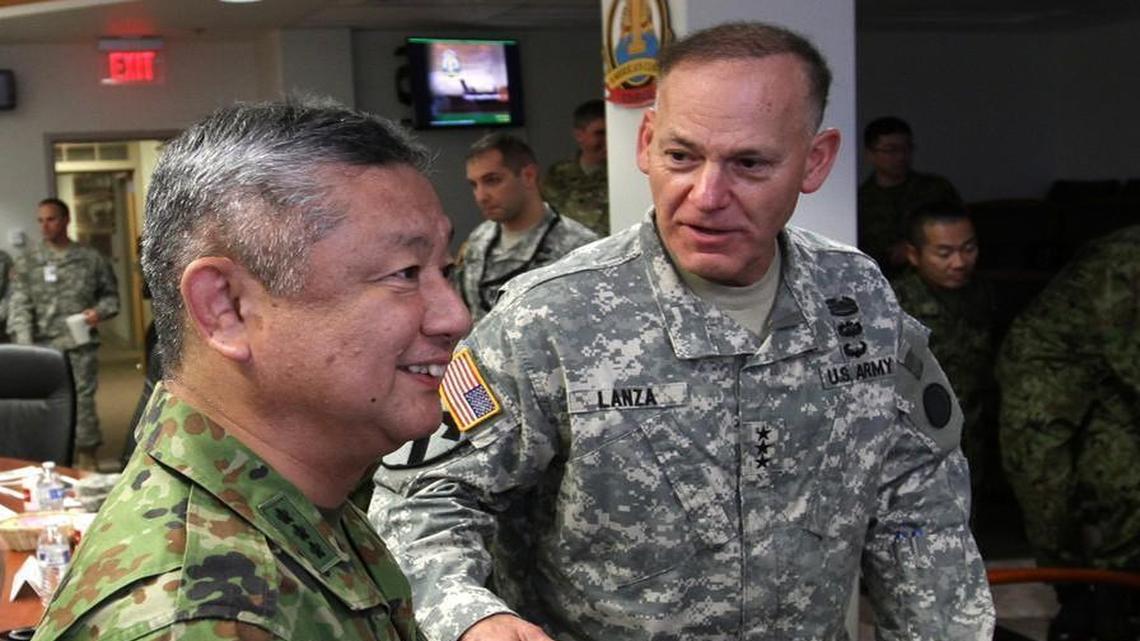 Lt. Gen. Stephen Lanza jokes with Lt. Gen. Junji Suzuki of the Japan Ground Self Defense Force during an October meeting at Joint Base Lewis-McChord. They were preparing for Yama Sakura, a December exercise in Japan that will link their commands. Army photo.