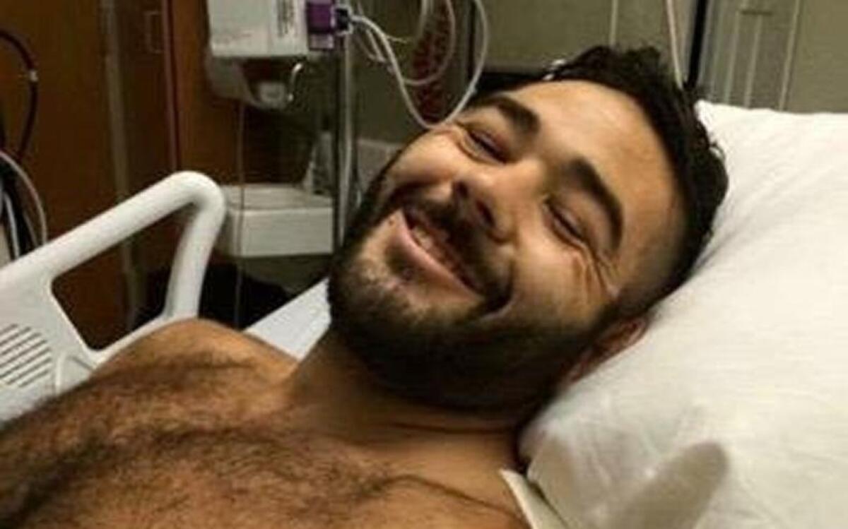 
Chris Mintz smiles from his hospital bed. The Army vet reportedly charged the Umpqua Community College shooter on Thursday. Mintz was shot seven times.
