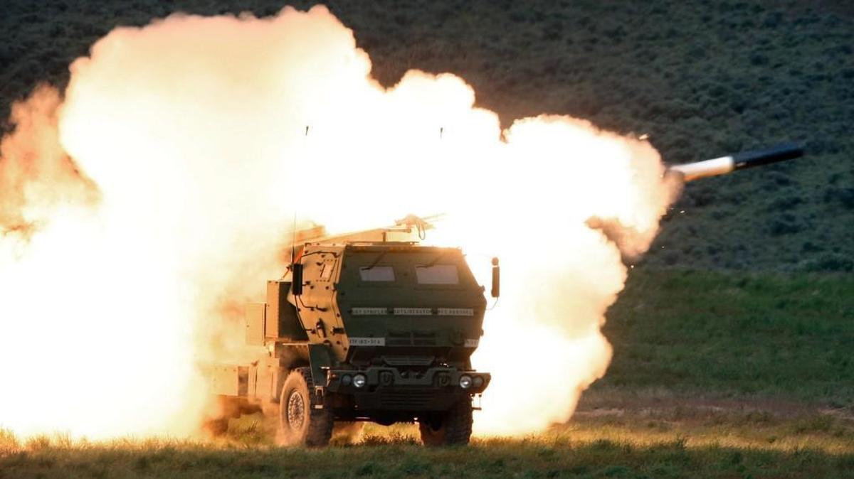 Flames engulf a launch truck as soldiers fire the High Mobility Artillery Rocket System in an exercise at the Yakima Training Center.