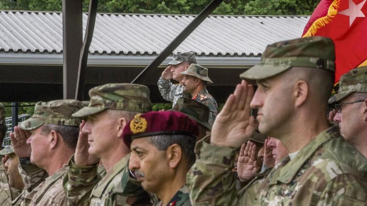 
Brig. Gen. Robert Ulses, top rear, and Brig. Guljeet Singh Jamwal of the Indian Army, next to Ulses, salute Wednesday during the opening ceremony for Yudh Abhyas, a training exercise with units from the Indian army at Joint Base Lewis-McChord.

