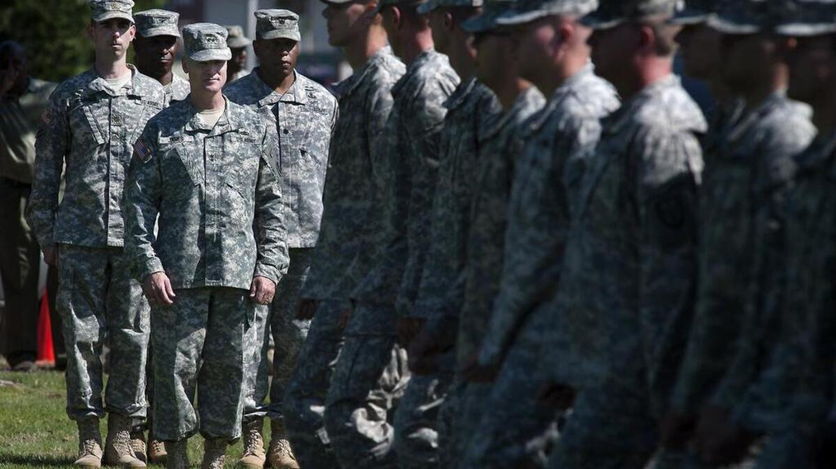 
New 7th ID commander Maj. Gen. Thomas James, middle left, observes the troops as they pass the reviewing stand Tuesday during the 7th Infantry Division Change of Command ceremony on Watkins Field on Joint Base Lewis-McChord.
