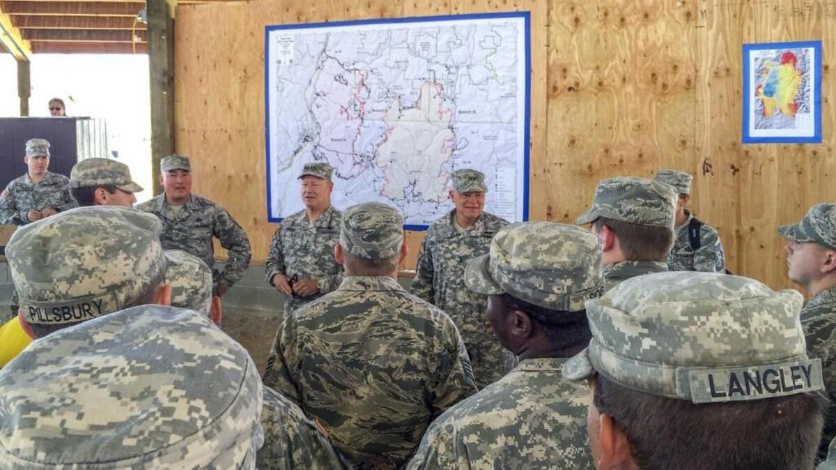 Gen. Frank Grass, chief of the U.S. National Guard Bureau, visited National Guard firefighting camps near Colville on Thursday. More than 2,000 National Guard members have been called up to fight fires in five Western states.