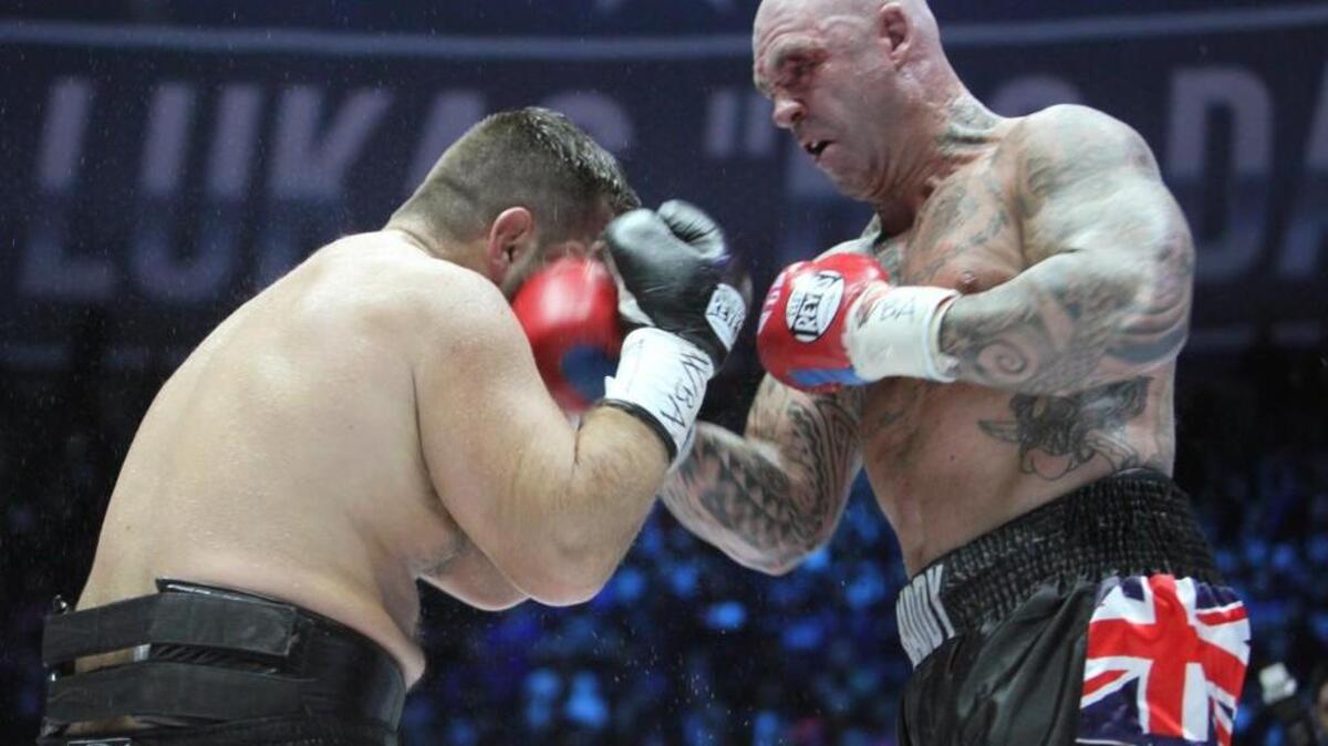 Australia's Lucas Browne, right, hits Uzbekistan's Ruslan Chagaev during their WBA world heavyweight boxing title match in Chechnya's provincial capital Grozny, Russia, Saturday, March 5, 2016.