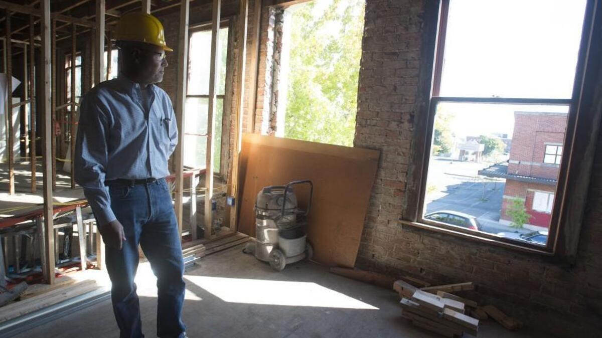 
Developer Kevin Grossman looks out last week from a studio apartment he and his partners are constructing in their renovation of the Kellogg-Sicker and Pochert buildings on Tacoma’s Hilltop. A Seattle-based historic preservationist speaking Thursday at the University of Washington Tacoma cites the project as an example of how to create healthy neighborhoods. 
