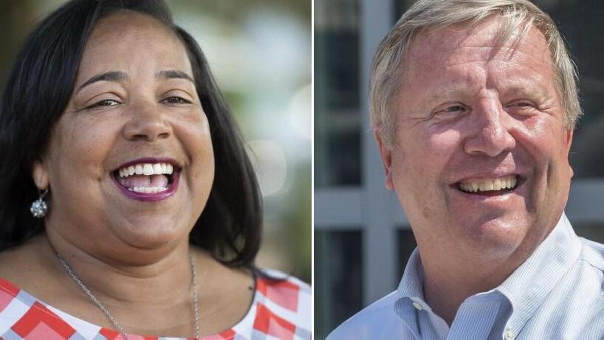 Victoria Woodards, left, used support in Tacoma’s North End to help her beat Jim Merritt in the recent mayoral election.